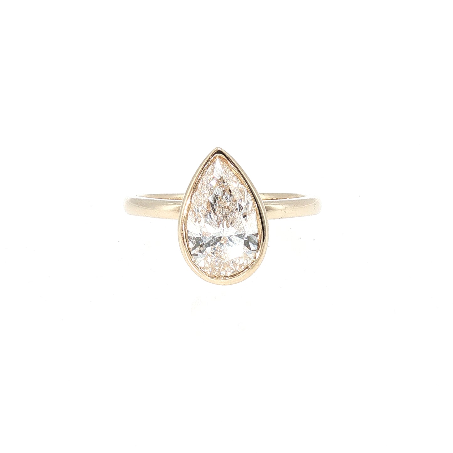 Yellow Gold Pear Cut Diamond Bezel Solitaire Ring